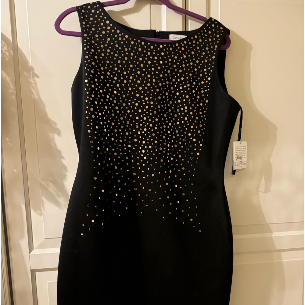 Calvin Klein black dress with gold accents. Size 14.